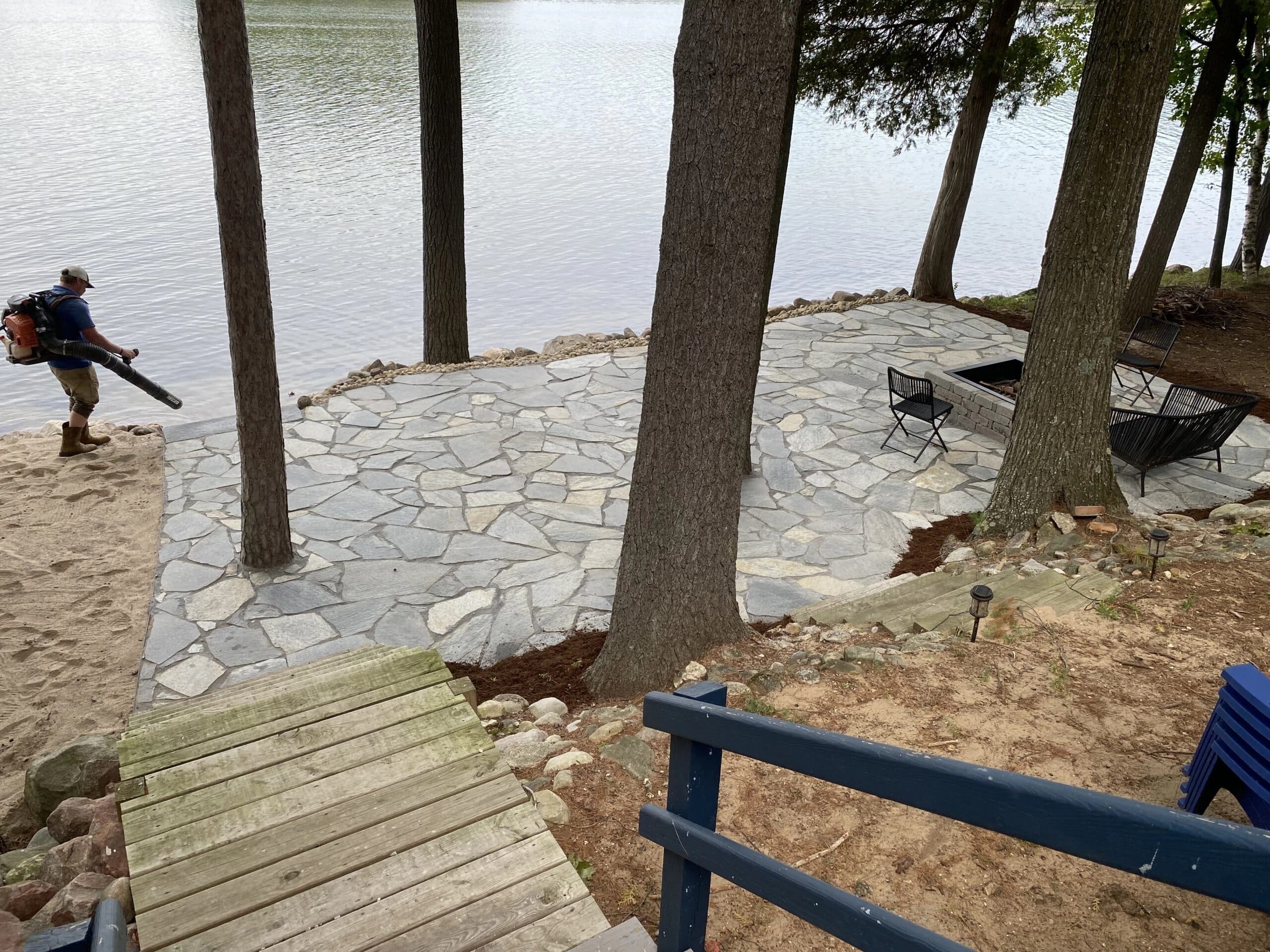 Lakefront walkway and boulder work along the house
